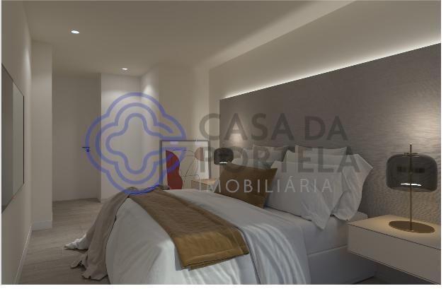 Appartement 2 chambres avec balcon et place de parking.