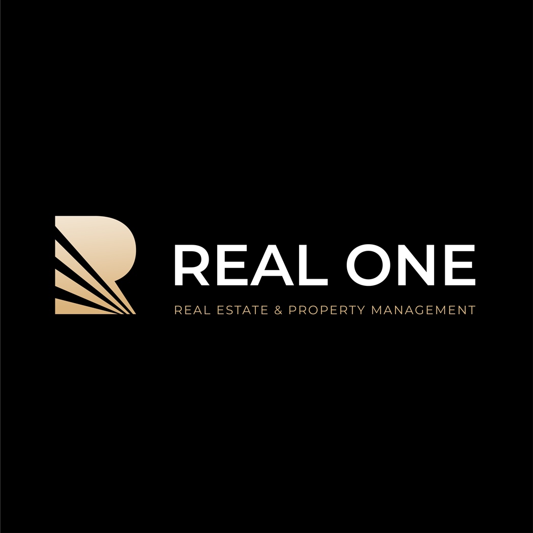 company logo : Real One - Real Estate & Property Management